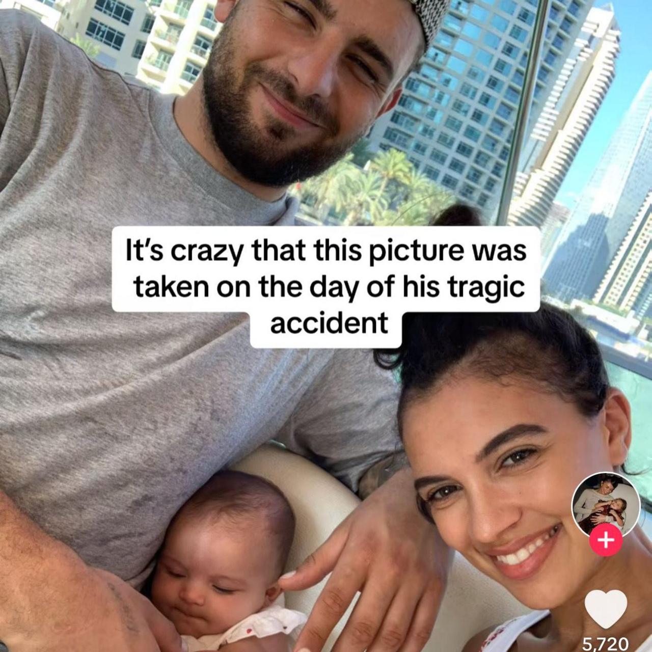 Image shows a man smiling with a short beard and moustache, he is with his partner, a brunette woman with olive skin and dark eye brows, who is smiling. Their daughter is only a few weeks old and cuddling into her father with her eyes closed. It is a TikTok post and the words say: 'It's crazy that this was taken on the day of his tragic accident'