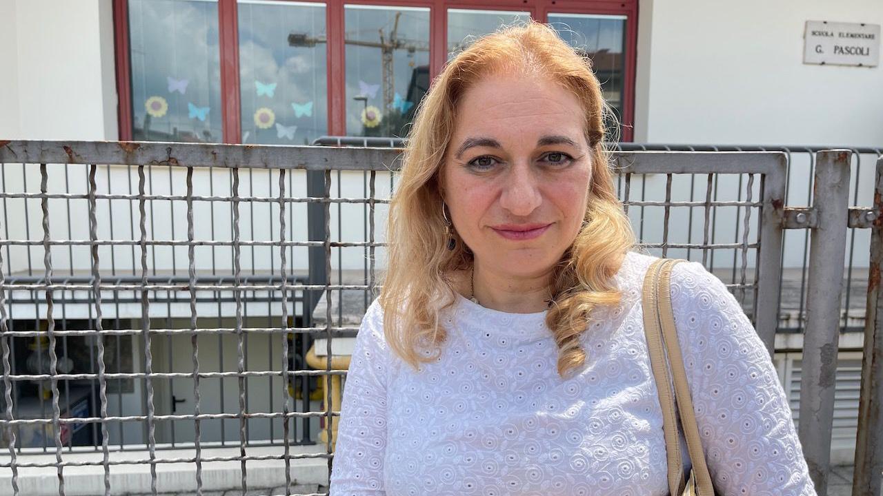 Headteacher Luana Scarfi, a woman in a white top with blonde hair