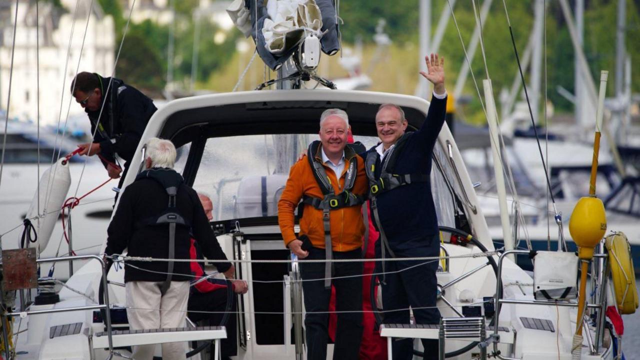 Ed Davey on a boat in Torbay