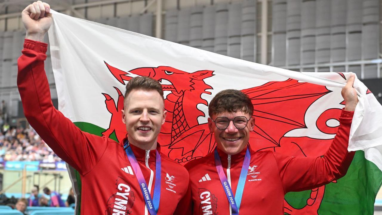 James Ball and Matt Rotherham with the Wales flag