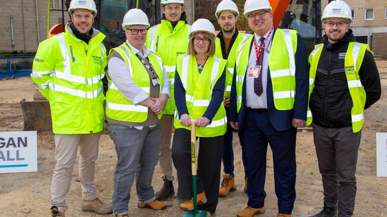 People wearing hardhats on a building site