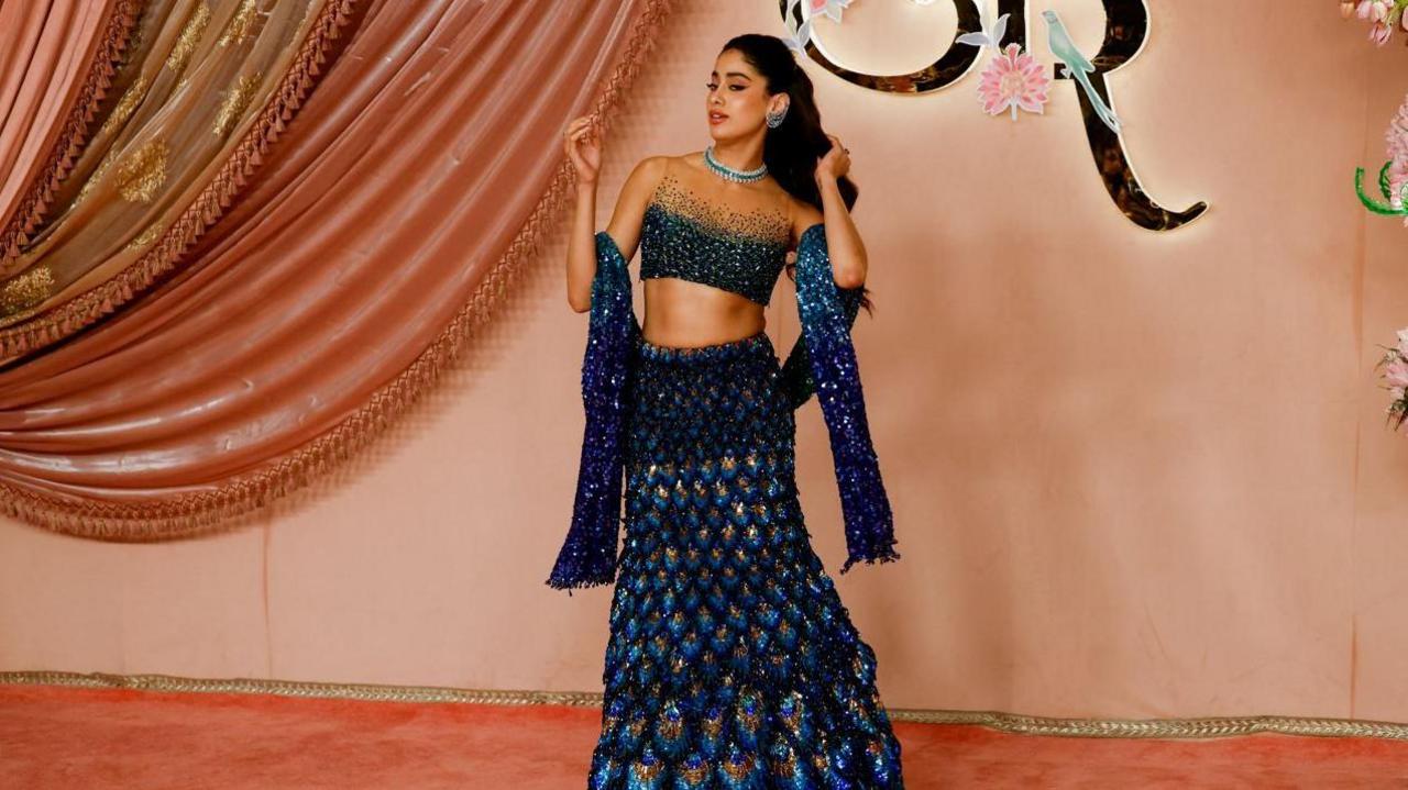 Indian actress Janhvi Kapoor poses on the red carpet during the sangeet ceremony of Anant Ambani and Radhika Merchant at Jio World Centre, Mumbai, India, July 5, 2024.