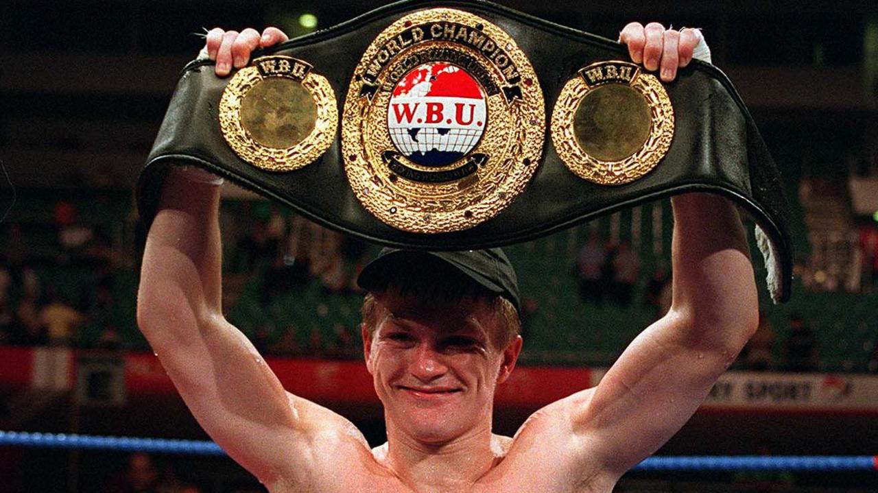 Ricky Hatton holds the WBU belt aloft
