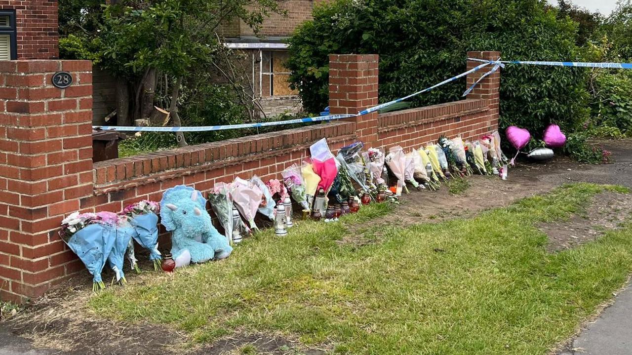 Tributes laid at the scene