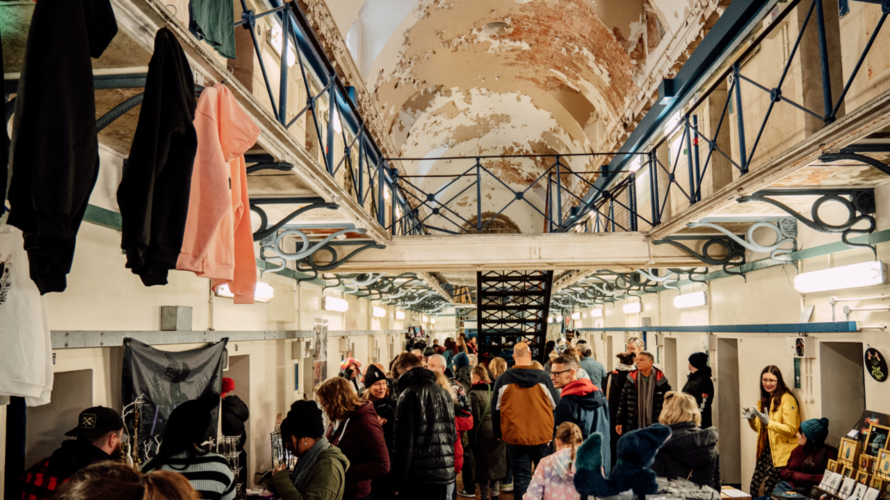 Gloucester's historic prison is filled with people visiting market stalls. 