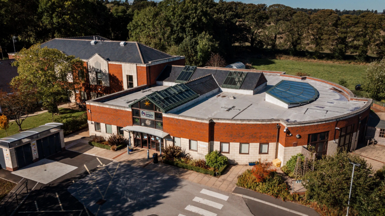 Ashgate Hospice a red brick and white stone building with a metal roof
