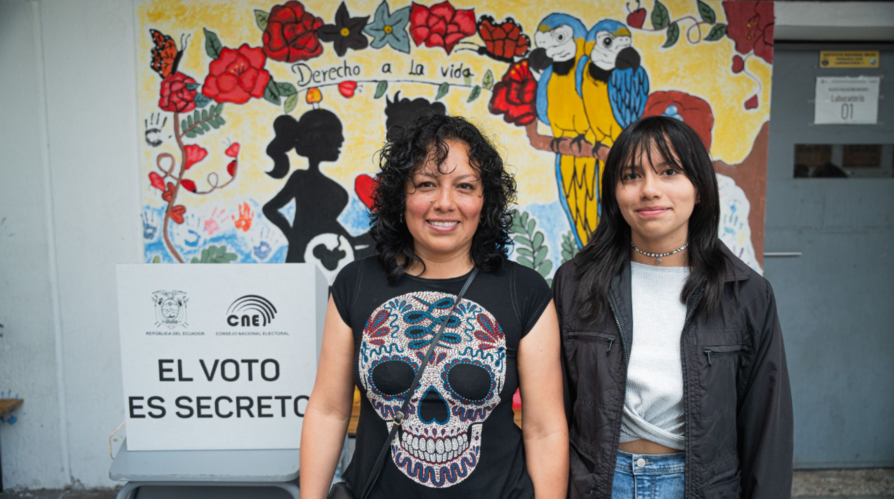 Fernanda Iza (left) poses for a photo after voting in the Ecuadorian election