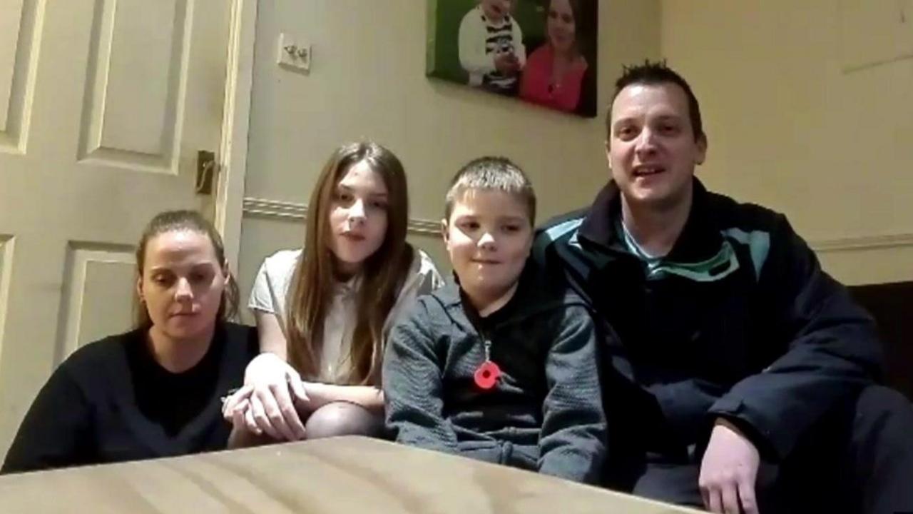 Left to right Amy Gauntlett, Phoebe Bates, Jake Bates and Chris Bates who are sat in their living room at home in Stafford