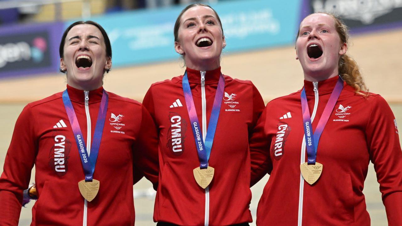 Rhian Edmunds, Emma Finucane and Lowri Thomas sing the Wales national anthem