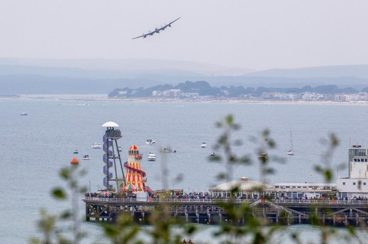 An Avro Lancaster aircraft flying over Bournemouth Pier