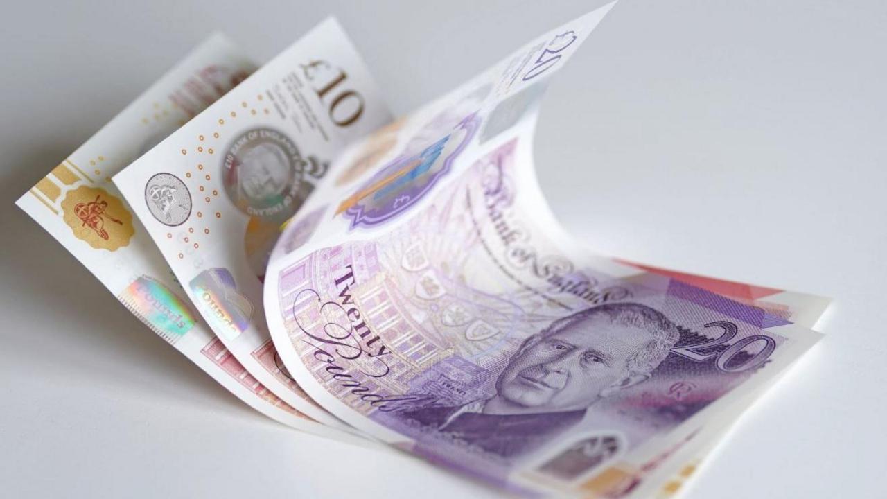 Photo of a view of £5, £10, £20 and £50 bank notes.