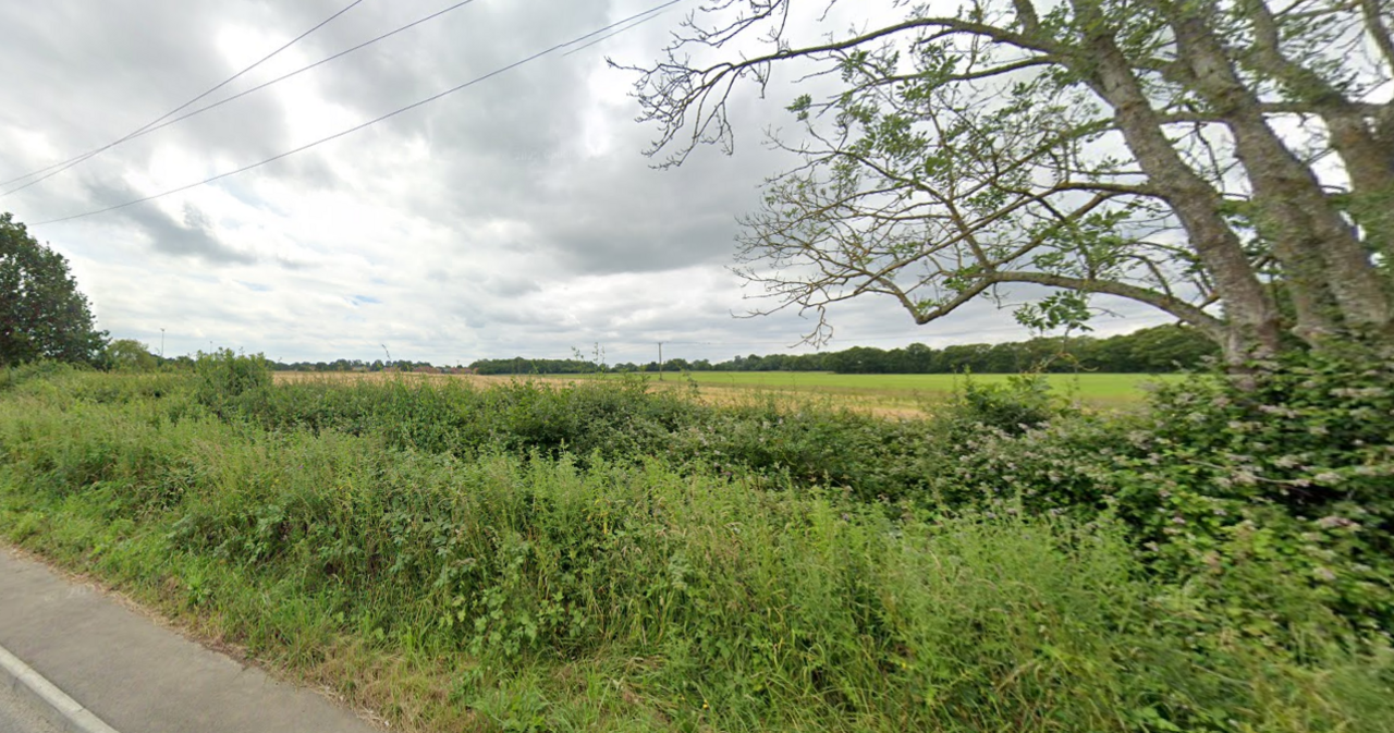 The location of the proposed building of 400 homes in a rural area of Surrey.