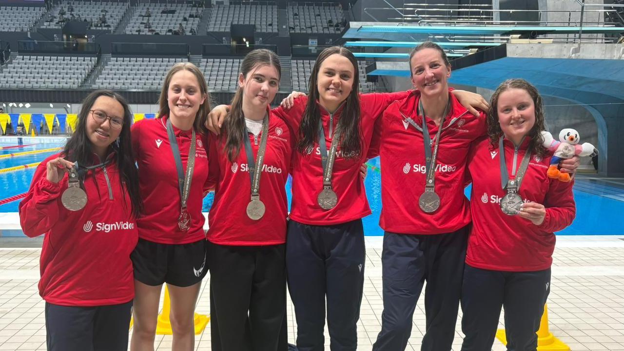 Great Britain's 4x100m medley relay team pose with silver medals