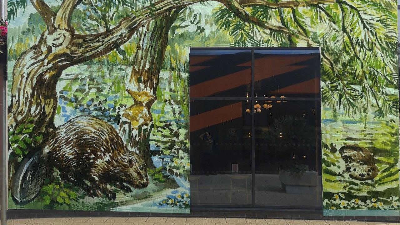 A mock-up artwork of a mural featuring two beavers.