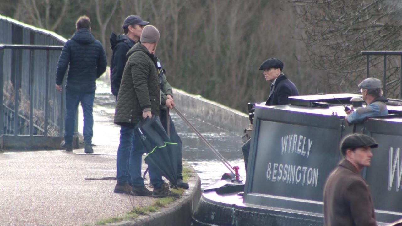 Cillian Murphy on a narrowboat on set for Peaky Blinders in Wrexham