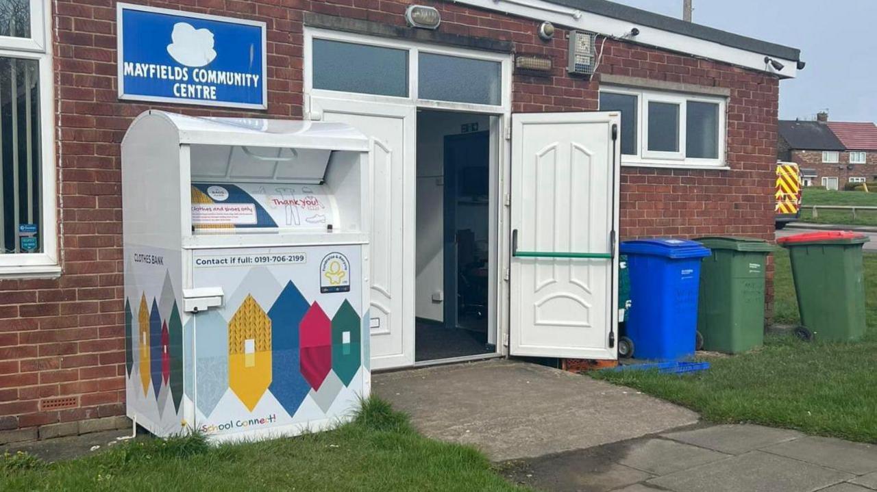 Image shows a single story brick building with a sign outside saying Mayfields Community Centre 