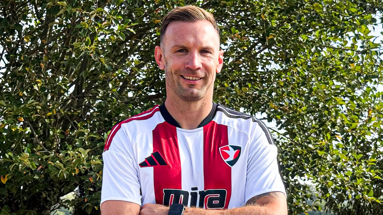 Andreas Weimann poses for a photo in the Cheltenham Town kit