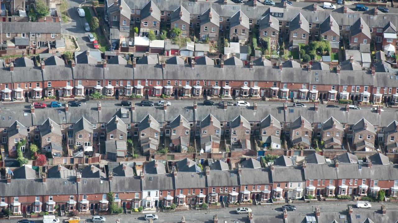 An aerial view of several streets of terraced housing in York city centre.