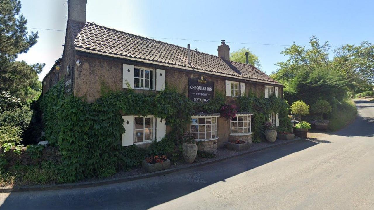 The frontage of the pub overlooking the road