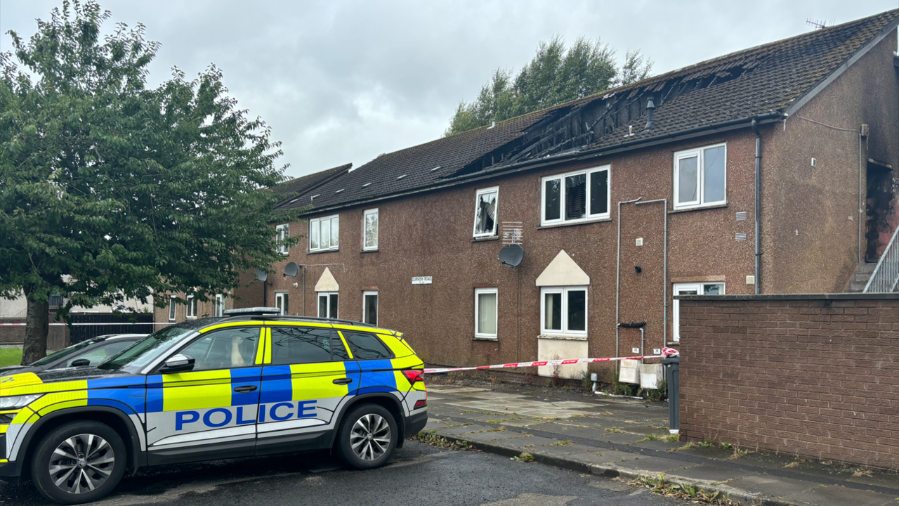 Police remain at the scene of the property with substantial fire damage and a collapsed roof