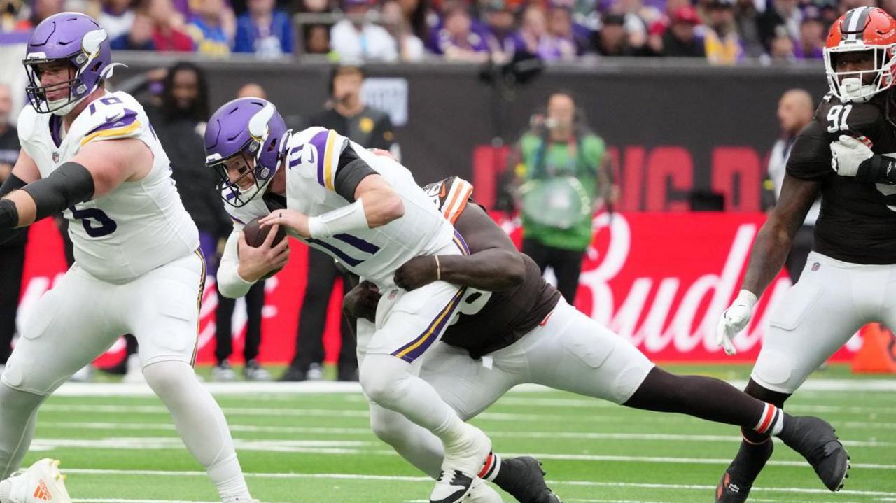 Carson Wentz is sacked by Maliek Collins as the Minnesota Vikings play the Cleveland Browns in London