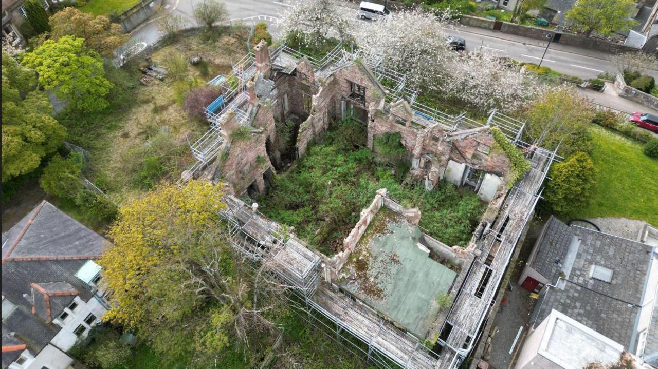 An image taken from a drone looking down into the ruins of Viewhill House