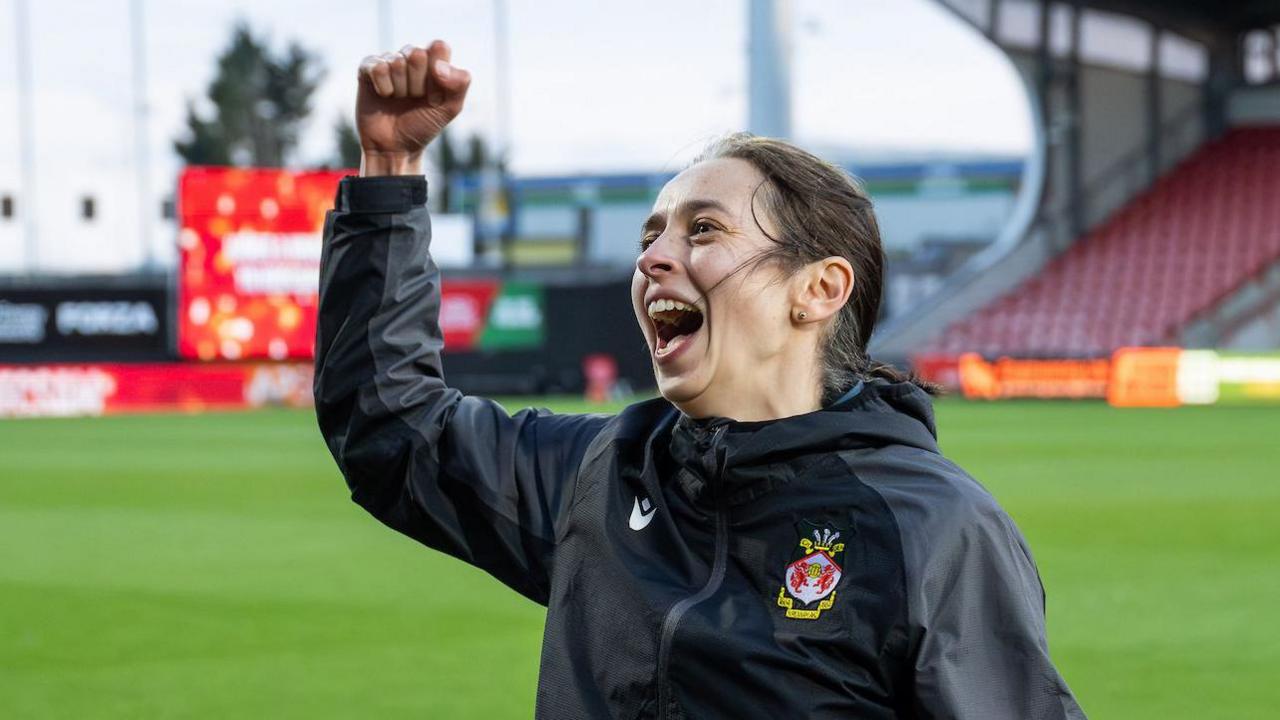 Jenny Sugarman celebrates Wrexham's title win at the Racecourse
