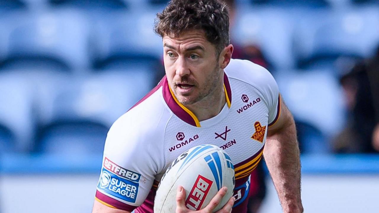 Adam Clune in action for Huddersfield Giants