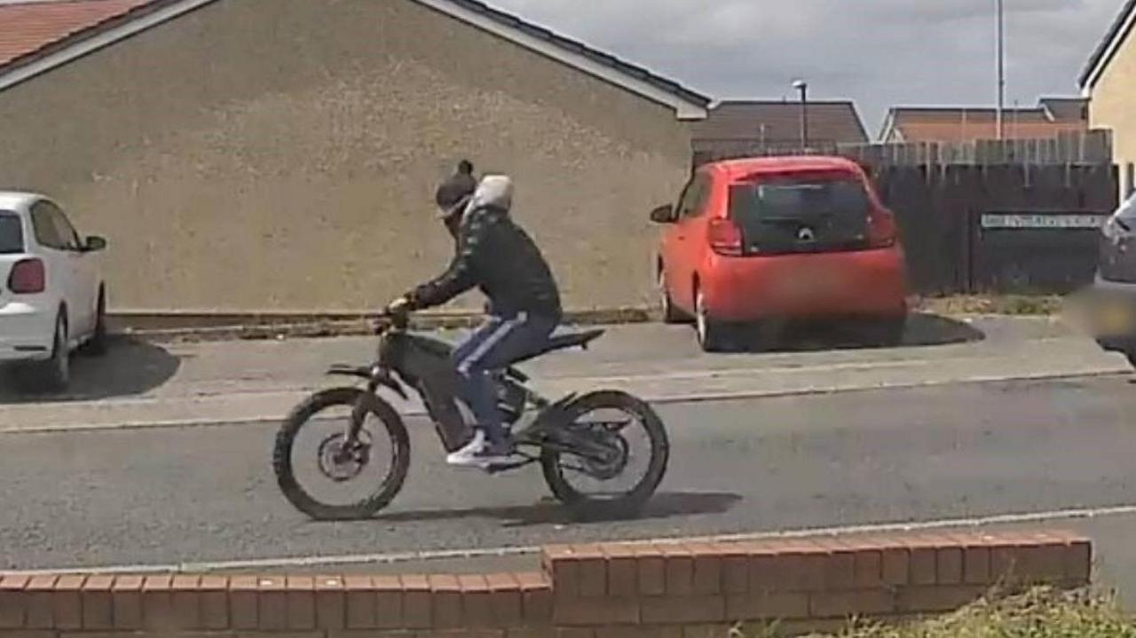 CCTV image showing e-bike rider