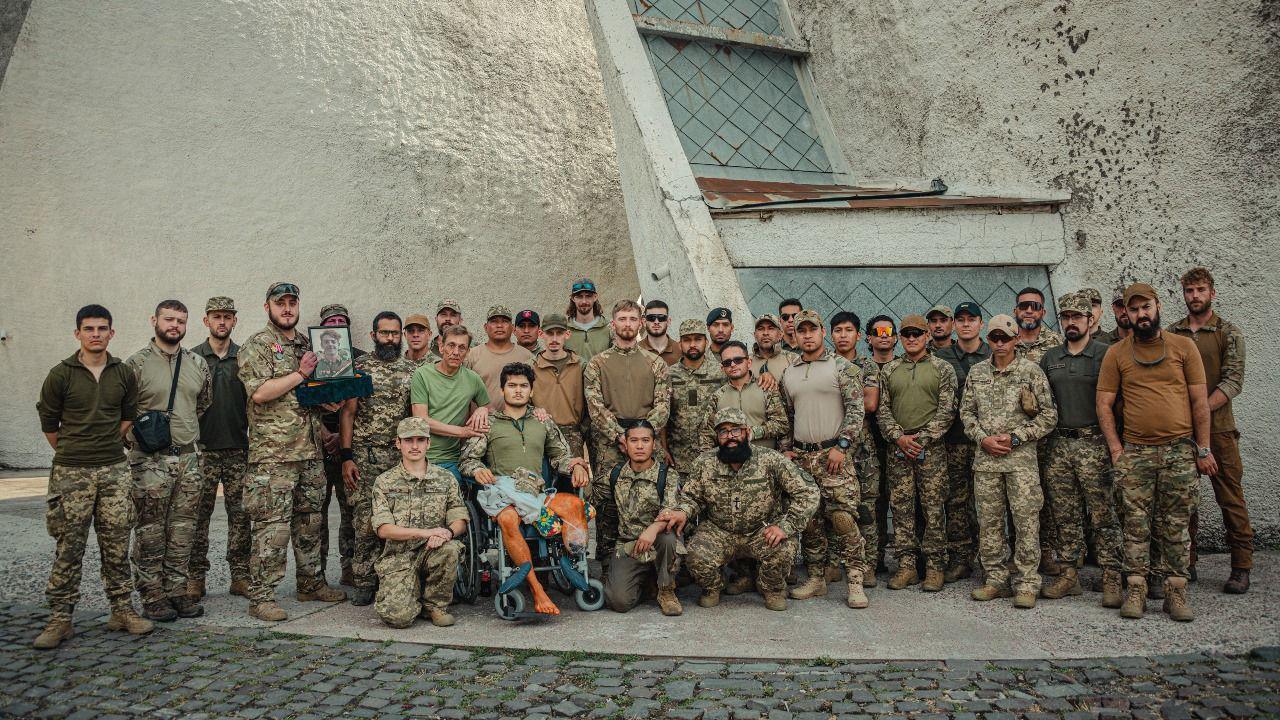 Graham pictured with members of James' unit in Ukraine.