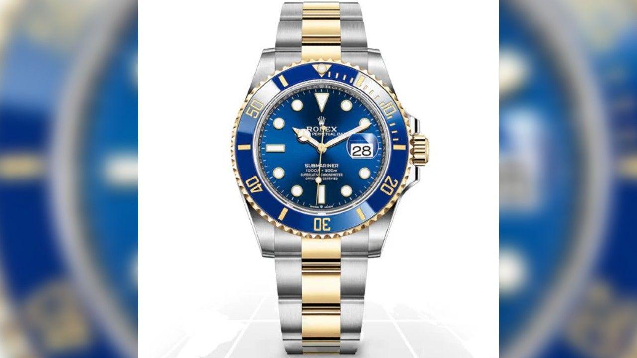 A Rolex watch with a blue face and a chrome and gold strap