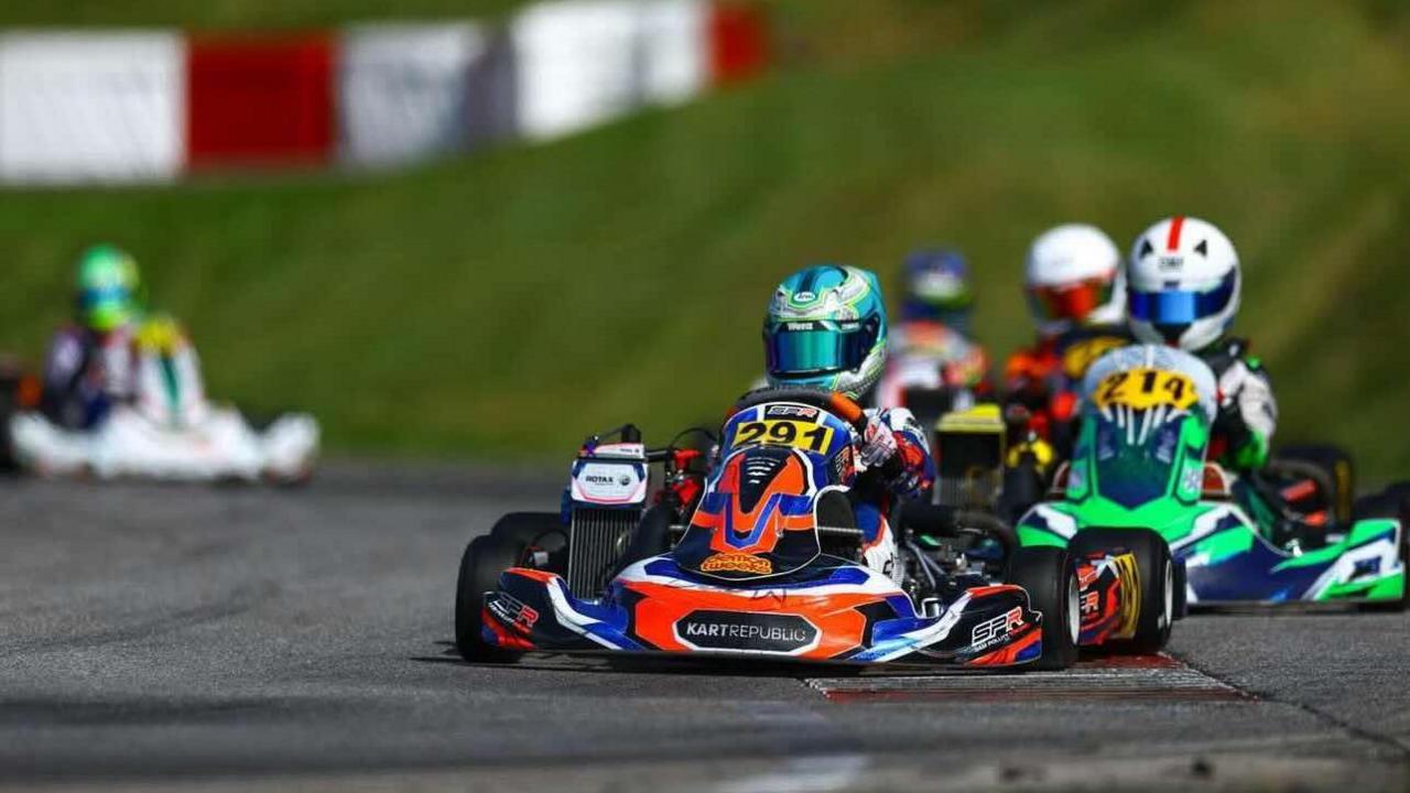 Jack, with a blue helmet on, is driving his kart with number 291on it. Four karts are following behind.