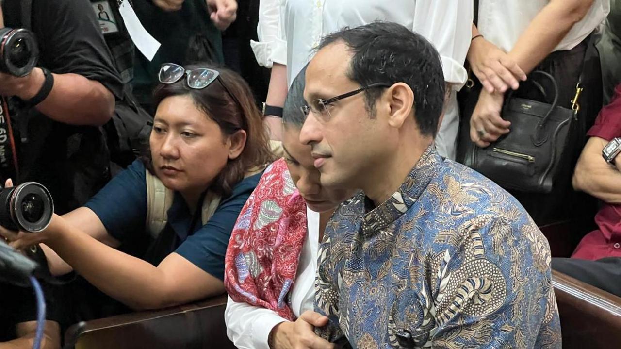 Nadiem's wife clutched his arm as they entered the courtroom on Tuesday morning 