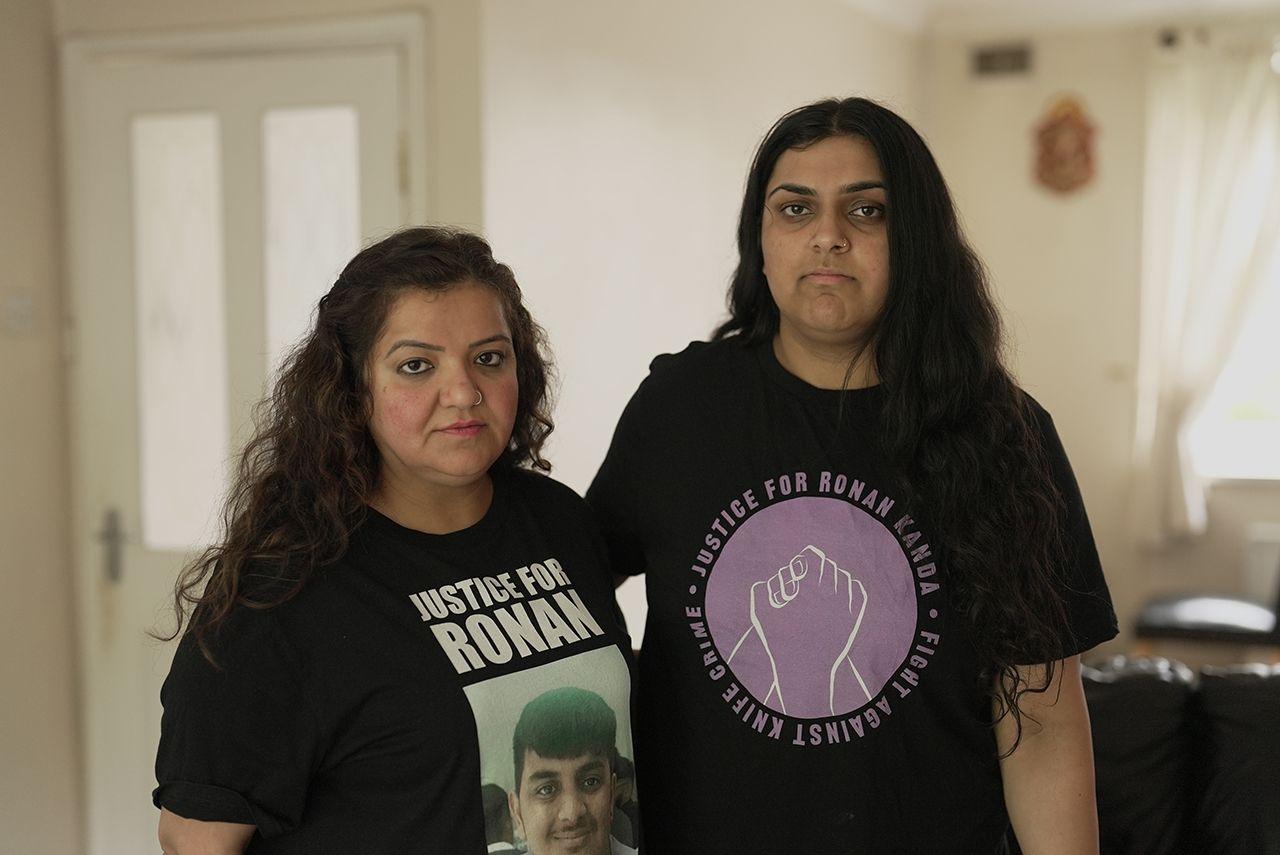 Pooja Kanda is wearing a black T-shirt with the words Justice for Ronan and a photo of her son who was killed in a sword attack. Her daughter Nikita stands next to her wearing a T-shirt saying: Justice for Ronan Kanda, fight against knife crime.