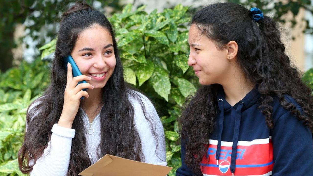 Pupils at St Dominic's Grammar in west Belfast turn up for their A-level results