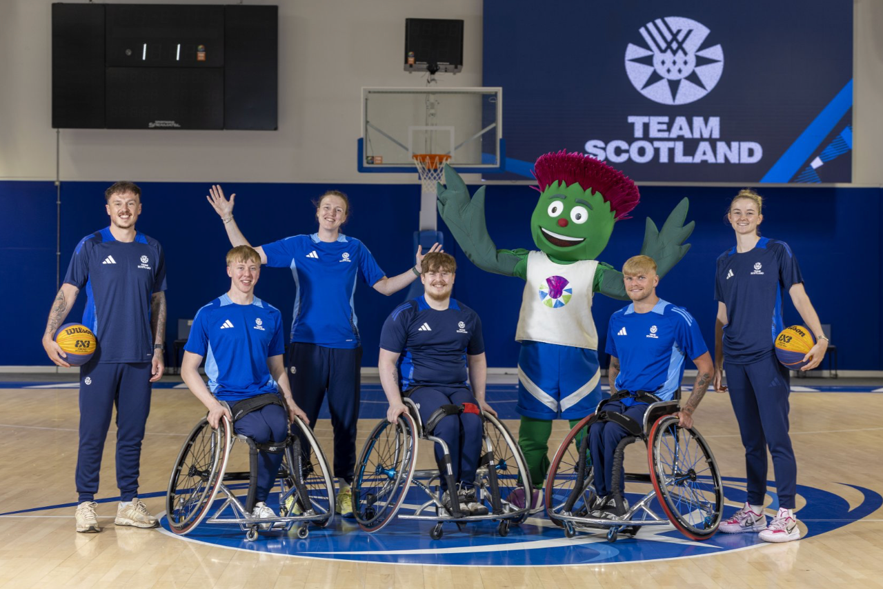 Undated handout by Team Scotland of Ella Docherty, Claire Paxton and Kyle Jimenez with Shayne Humphries and Finlay Erskine, and Tyler Baines with mascot Clyde.
