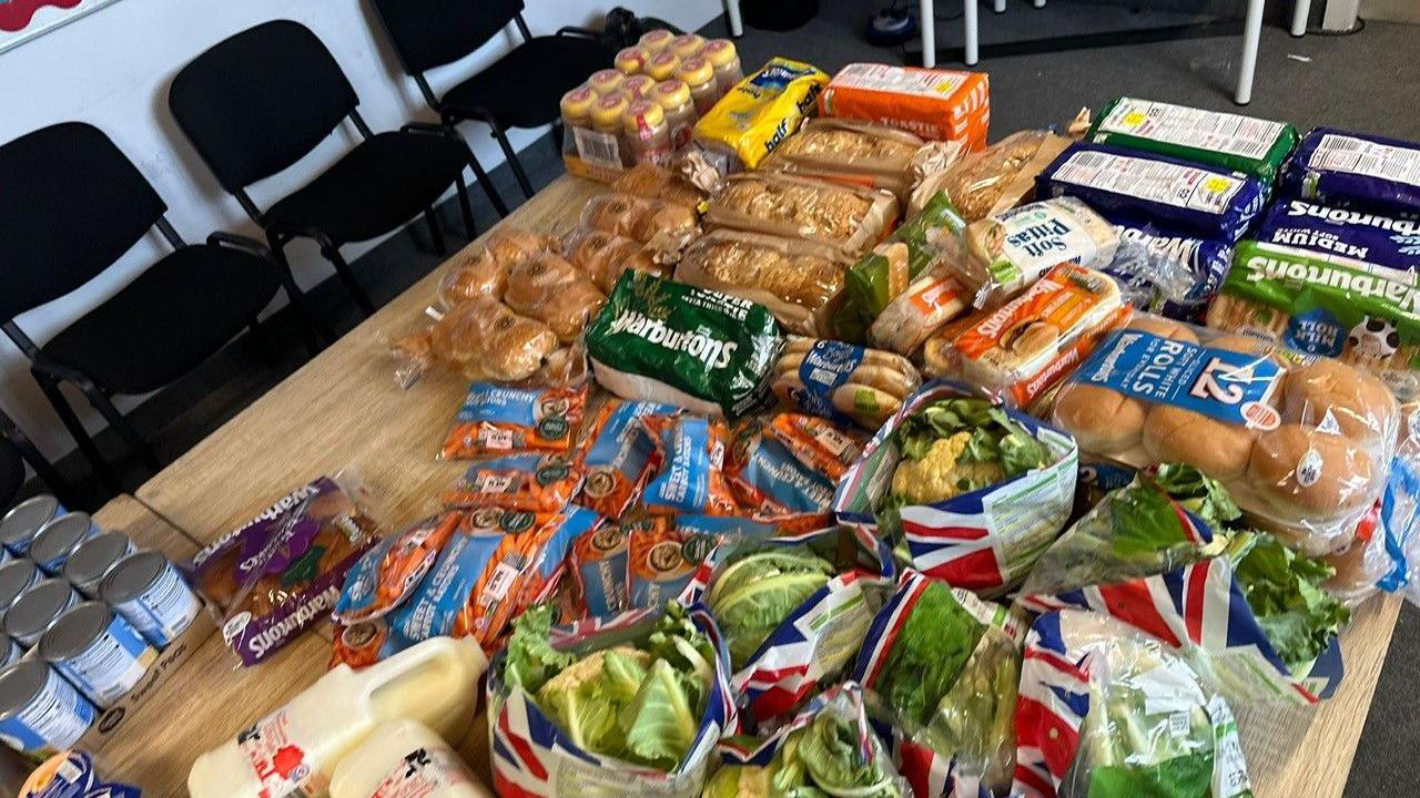 A table full of donated unwanted food