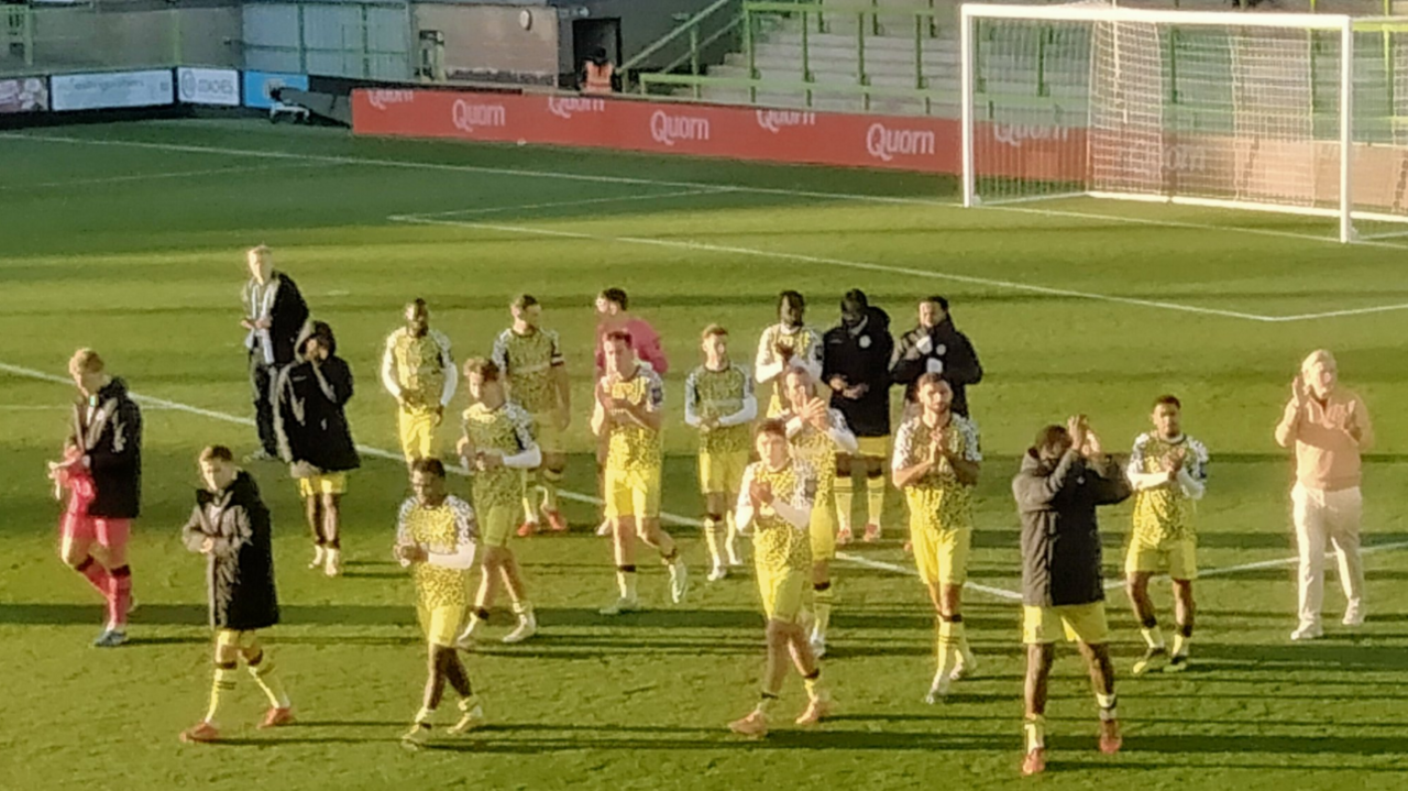 Robbie Savage (right) and his players applaud Forest Green Rovers fans after the 2-1 win over Boreham Wood