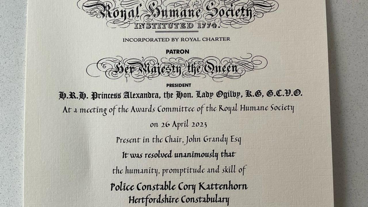 A photo of the award issued by the Royal Humane Society. It's a piece of paper that details when it was given and who it was given to.