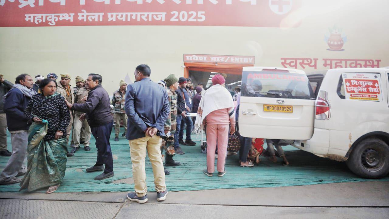 Officials standing outside a temporary hospital at the Kumbh Mela in Prayagraj city.