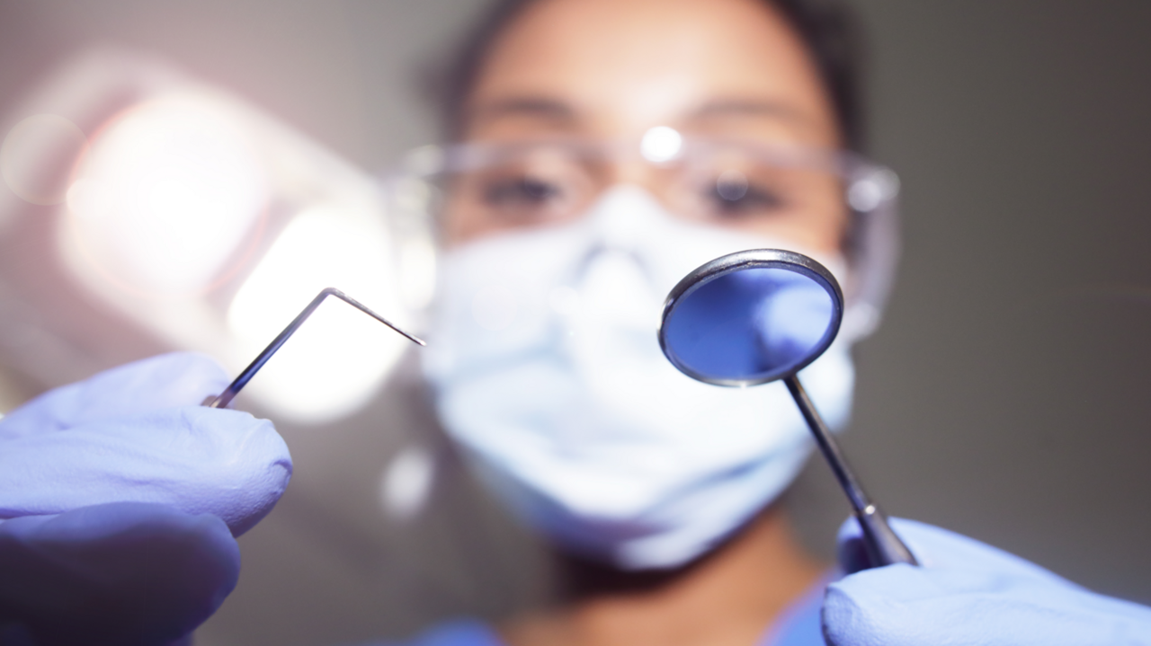 A woman with dental tools