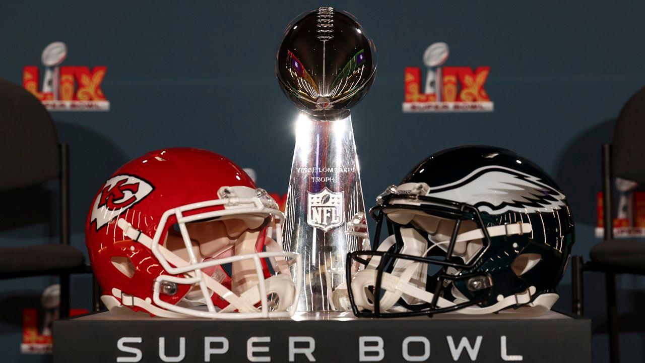 The Super Bowl trophy and Chiefs and Eagles helmets