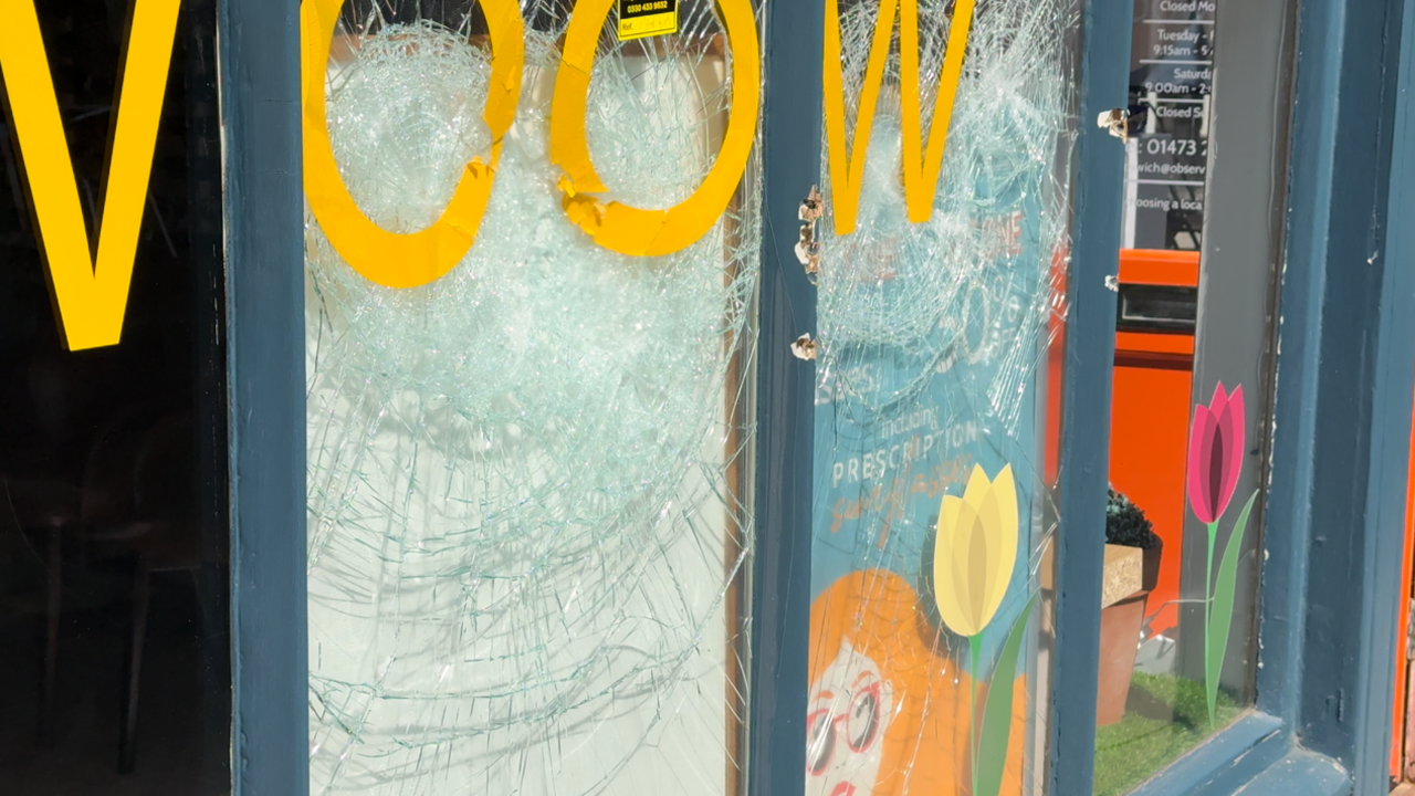 Another view of an Ipswich shop front that has a smashed window.