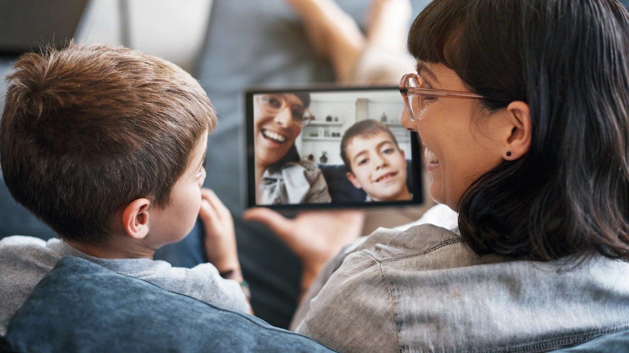 Woman looking at picture of her and child online