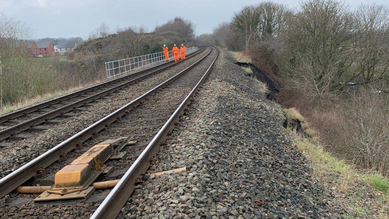 Engineers near the land slip