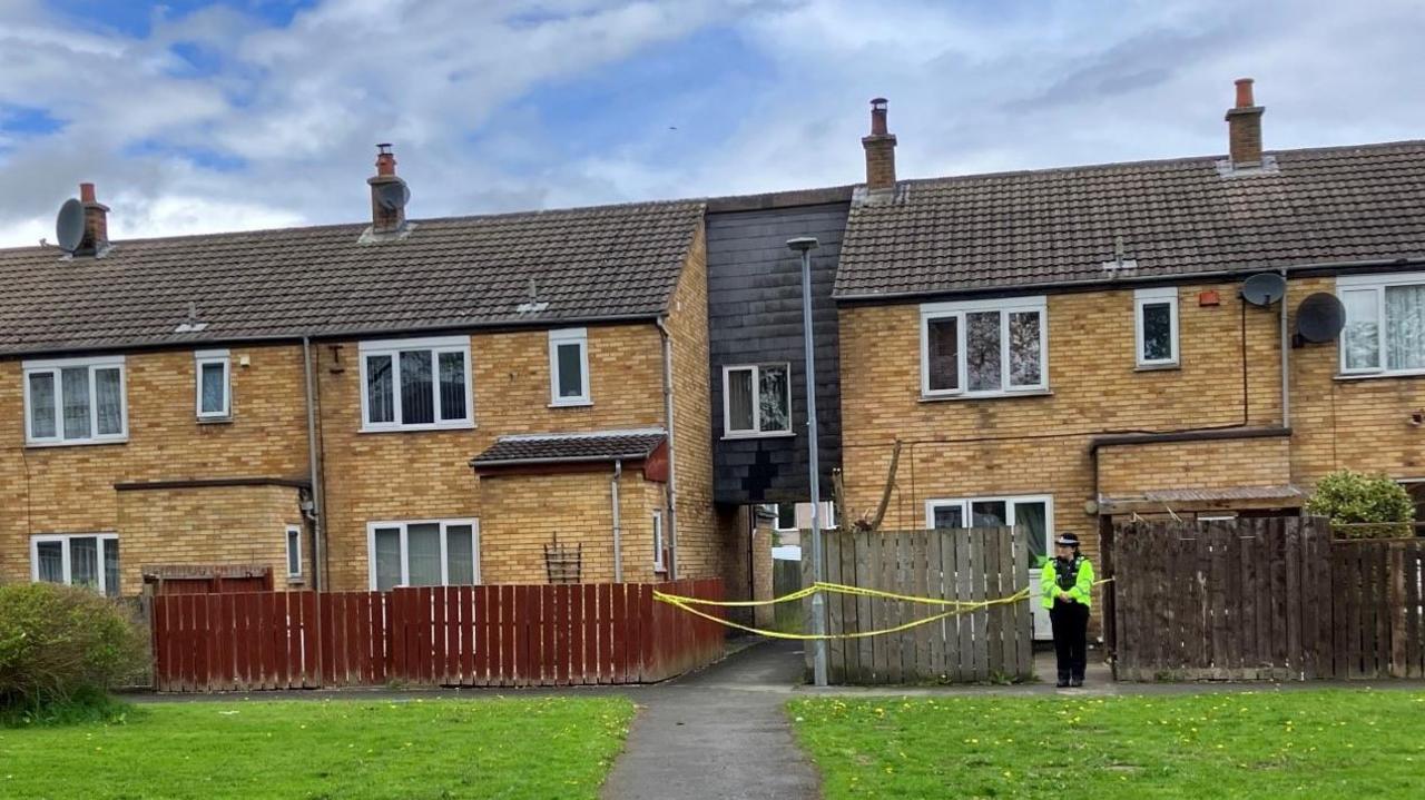 Police in front of house