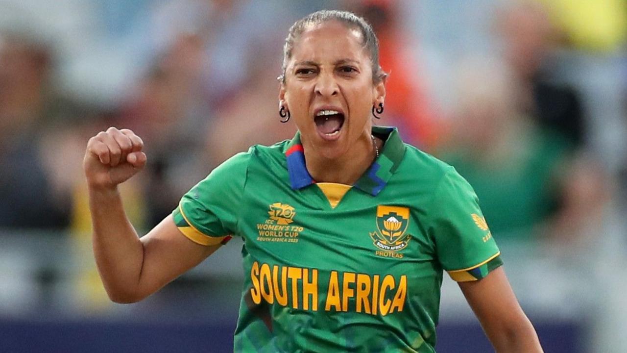 Shabnim Ismail, wearing a green South Africa kit, celebrates a wicket