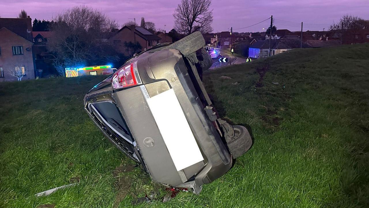 A car on its side in Guyhirn