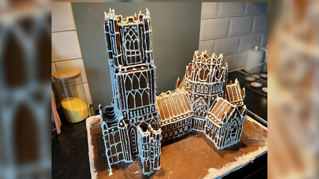 Ely Cathedral in Gingerbread, made by Owen Angier, the model is nearly 60cm (2ft) long and just over 30cm (1ft) high. It has white icing around the doors and windows, and he melted boiled sweets to make edible stained glass windows.