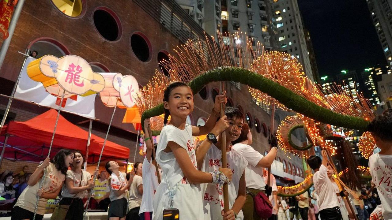 Children taking part in the Tai Hang fire dragon dance as part of the Mid-Autumn Festival celebrations. 